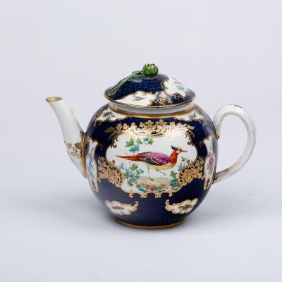 Appraisal: A Worcester style blue scale teapot painted exotic birds within