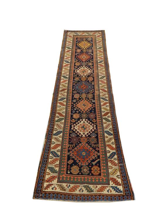 Appraisal: RUG Antique Caucasian Kazak runner ' x ' accents of