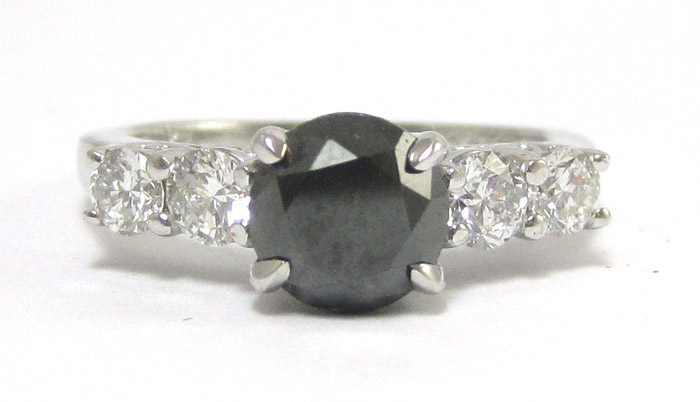 Appraisal: BLACK DIAMOND AND FOURTEEN KARAT WHITE GOLD RING having two