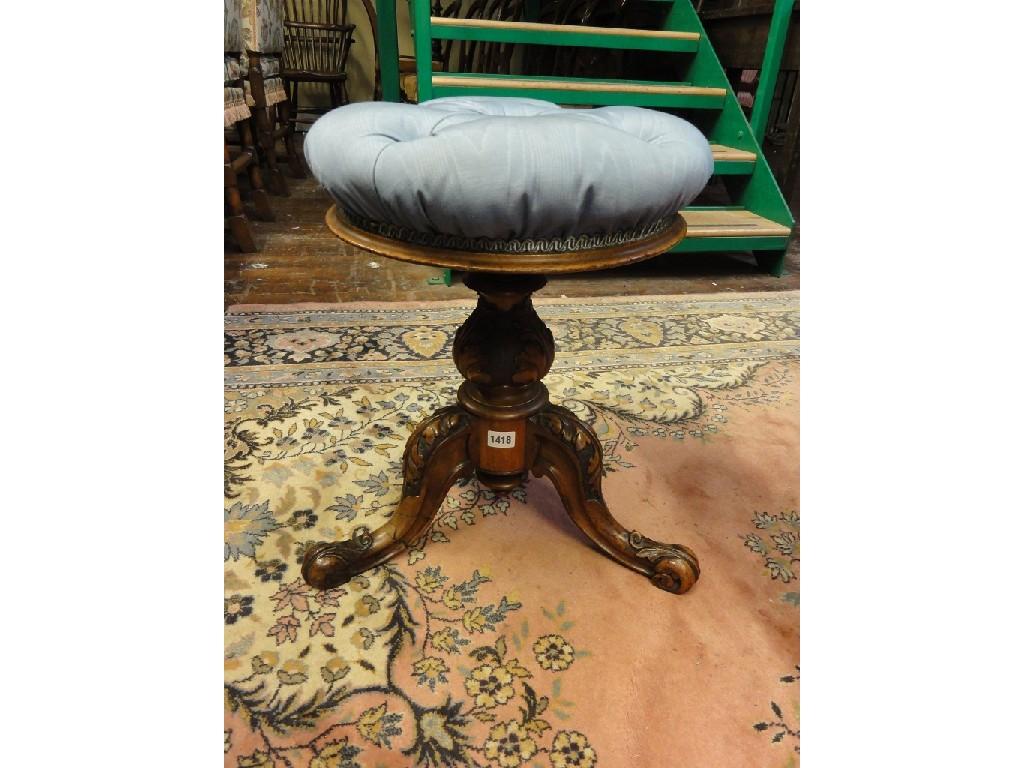 Appraisal: A Victorian walnut piano stool with circular revolving buttoned upholstered