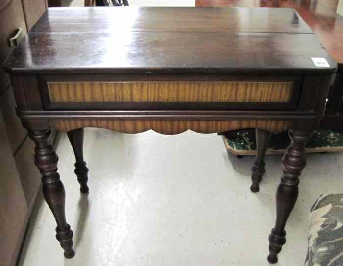 Appraisal: WALNUT AND MAHOGANY SPINET DESK American c 's having a