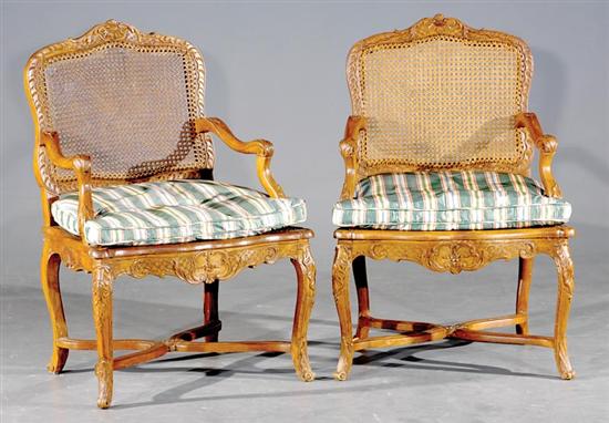 Appraisal: Pair Louis XV carved fruitwood and cane fauteuils late th