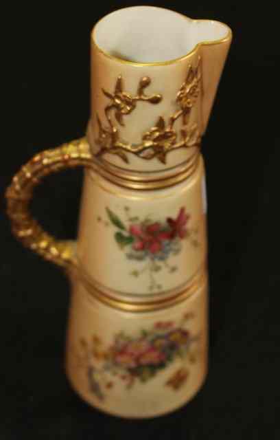 Appraisal: A ROYAL WORCESTER JUG of tapering cylindrical form with loop