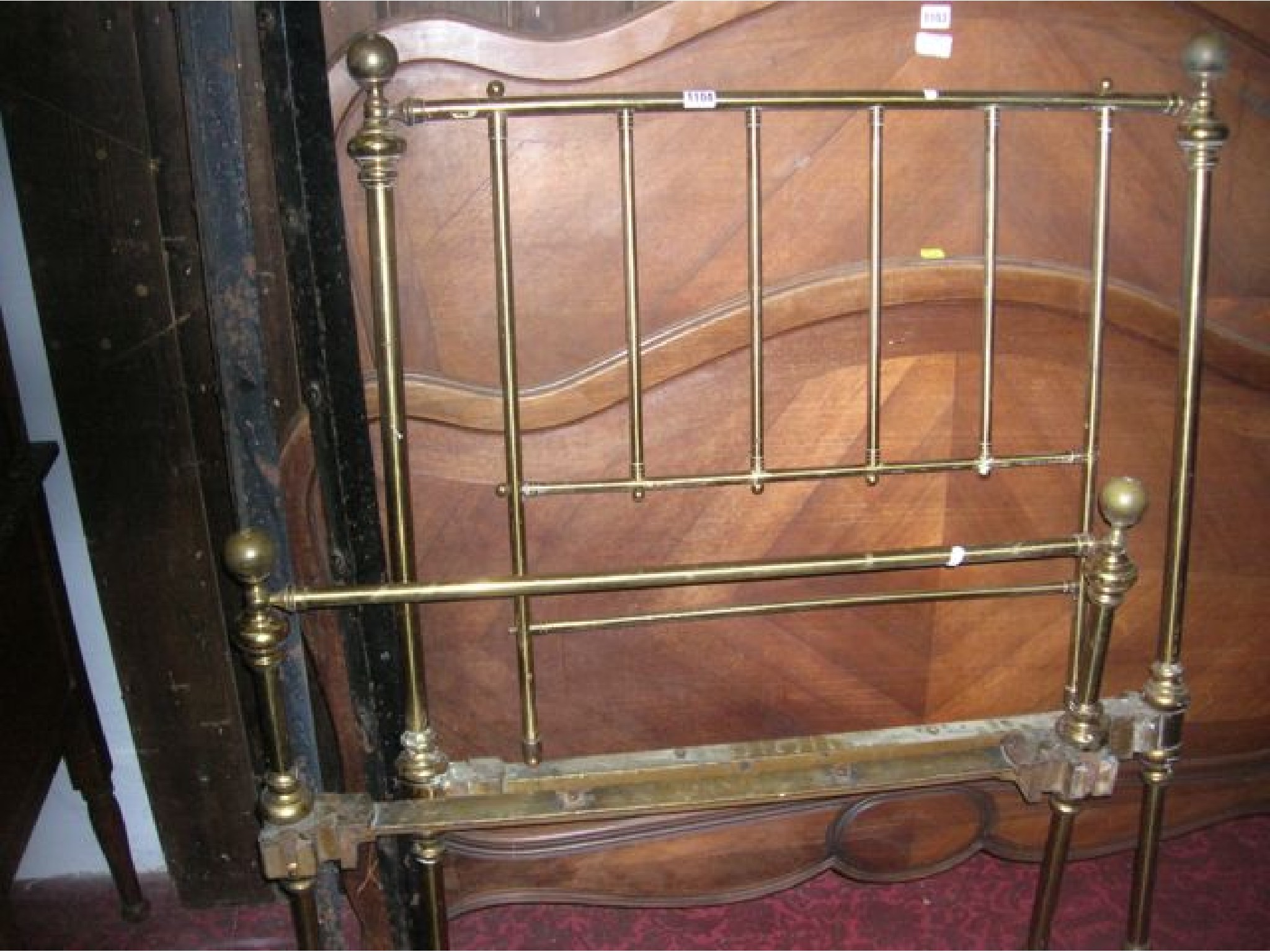 Appraisal: A Victorian brass single bedstead with vertical turned rails and