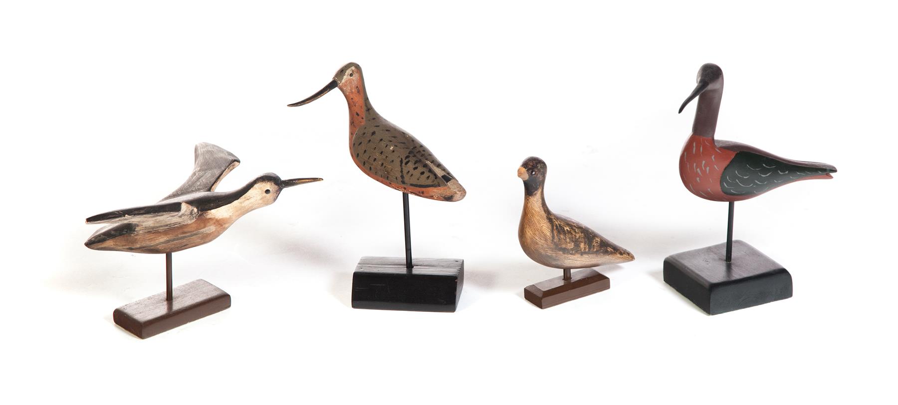 Appraisal: FOUR CARVED AND PAINTED SHORE BIRDS American nd half- th