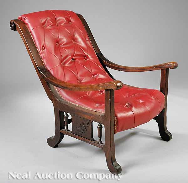 Appraisal: An American Carved Walnut Planter's Chair th c scrolled back