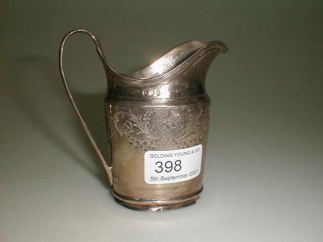 Appraisal: A George II silver helmet cream jug engraved with a