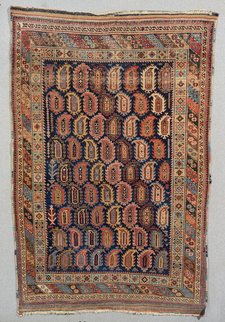 Appraisal: AN OLD BLUE GROUND AFSHAR RUG decorated nine rows of