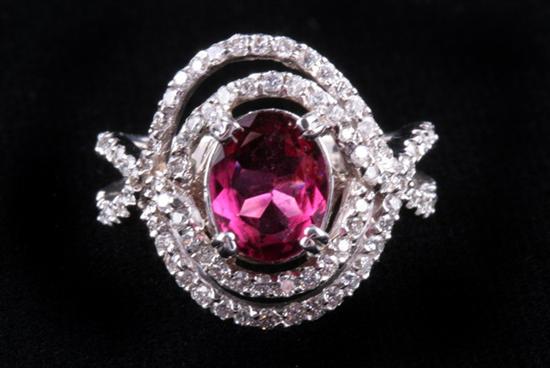 Appraisal: K WHITE GOLD PINK CUPRIAN TOURMALINE AND DIAMOND RING Oval