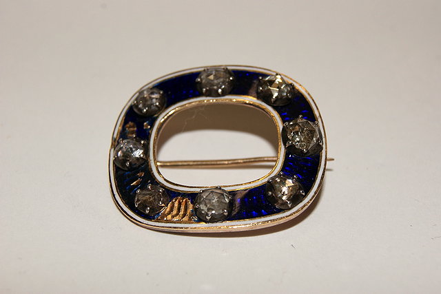 Appraisal: A TH CENTURY YELLOW METAL BUCKLE with blue enamel and