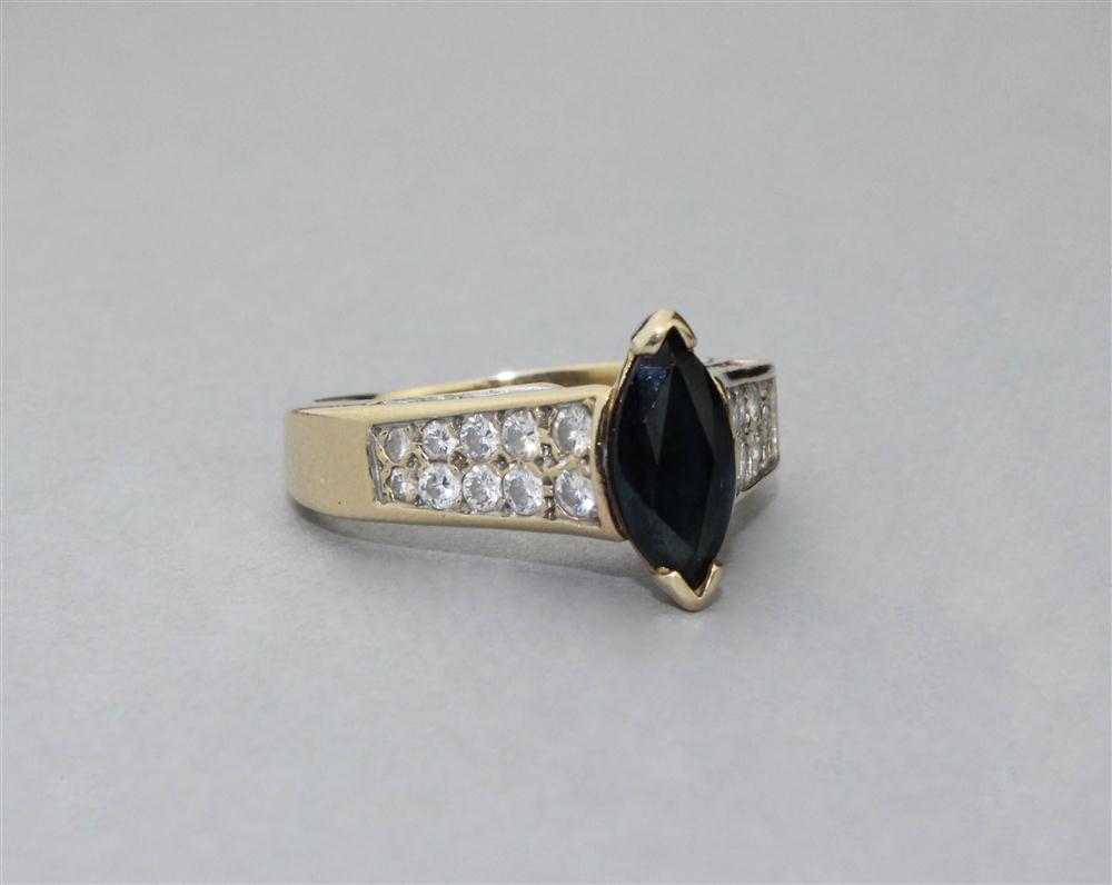 Appraisal: MARQUISE CUT BLUE SAPPHIRE RING WITH DIAMONDS SET IN K