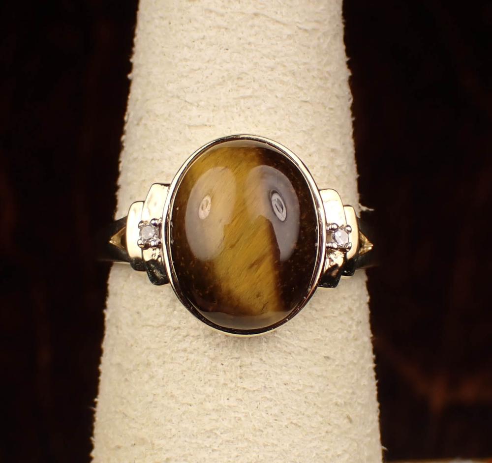 Appraisal: TIGER'S EYE DIAMOND AND TEN KARAT GOLD RING having a