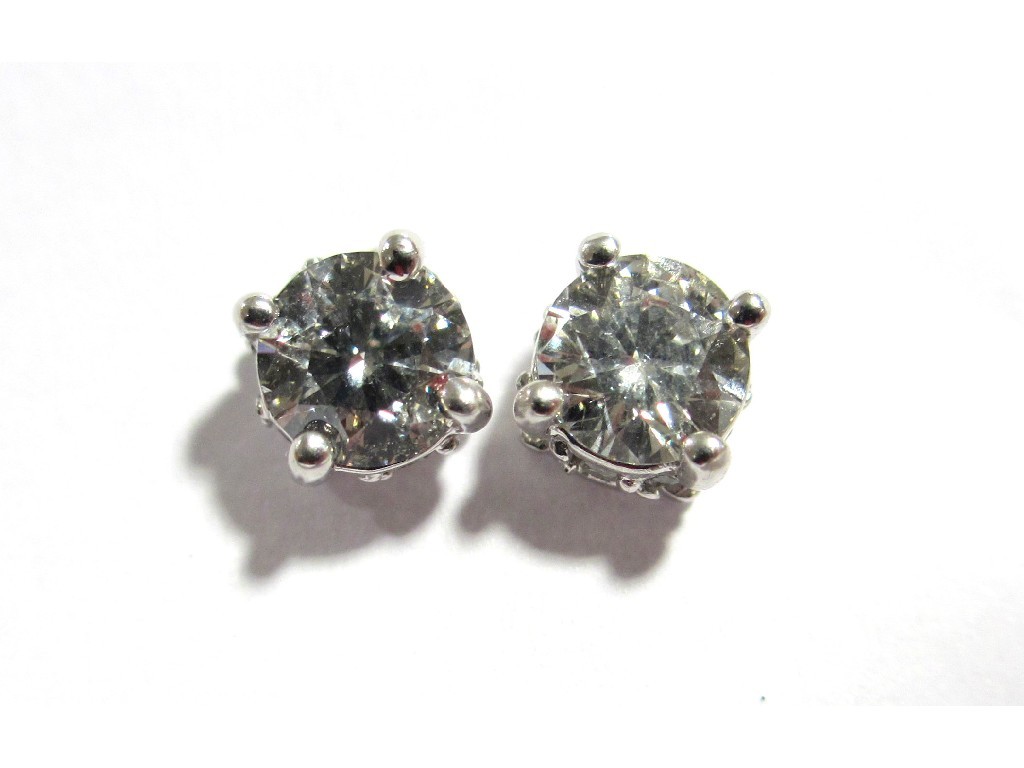 Appraisal: A pair of ct gold mounted diamond stud earrings with