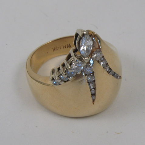 Appraisal: DIAMOND AND FOURTEEN KARAT GOLD RING set with a marquise-cut