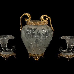 Appraisal: A Continental Gilt Metal Mounted Molded Glass Vase and Two