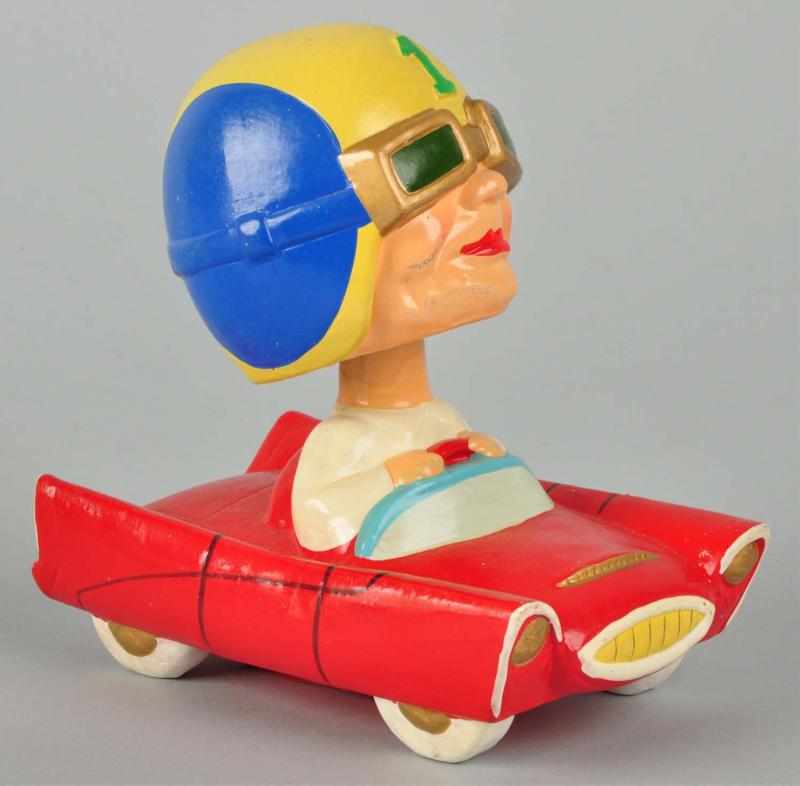 Appraisal: Race Car Driver Bobbing Head Doll Description Marked number on