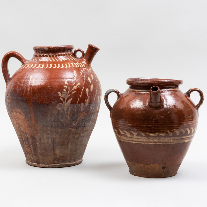 Appraisal: Two Slip Decorated Earthenware Jugs Unmarked The larger x in