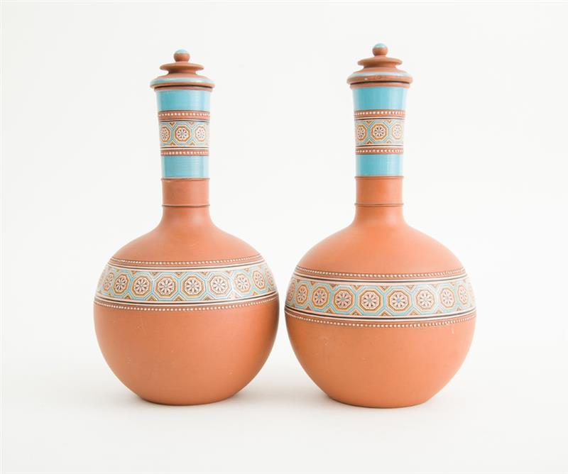 Appraisal: WATCOMBE TERRACOTTA CO TORQUAY Pair of water bottles and stoppers