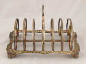 Appraisal: A silver William IV six piece toast rack with cast