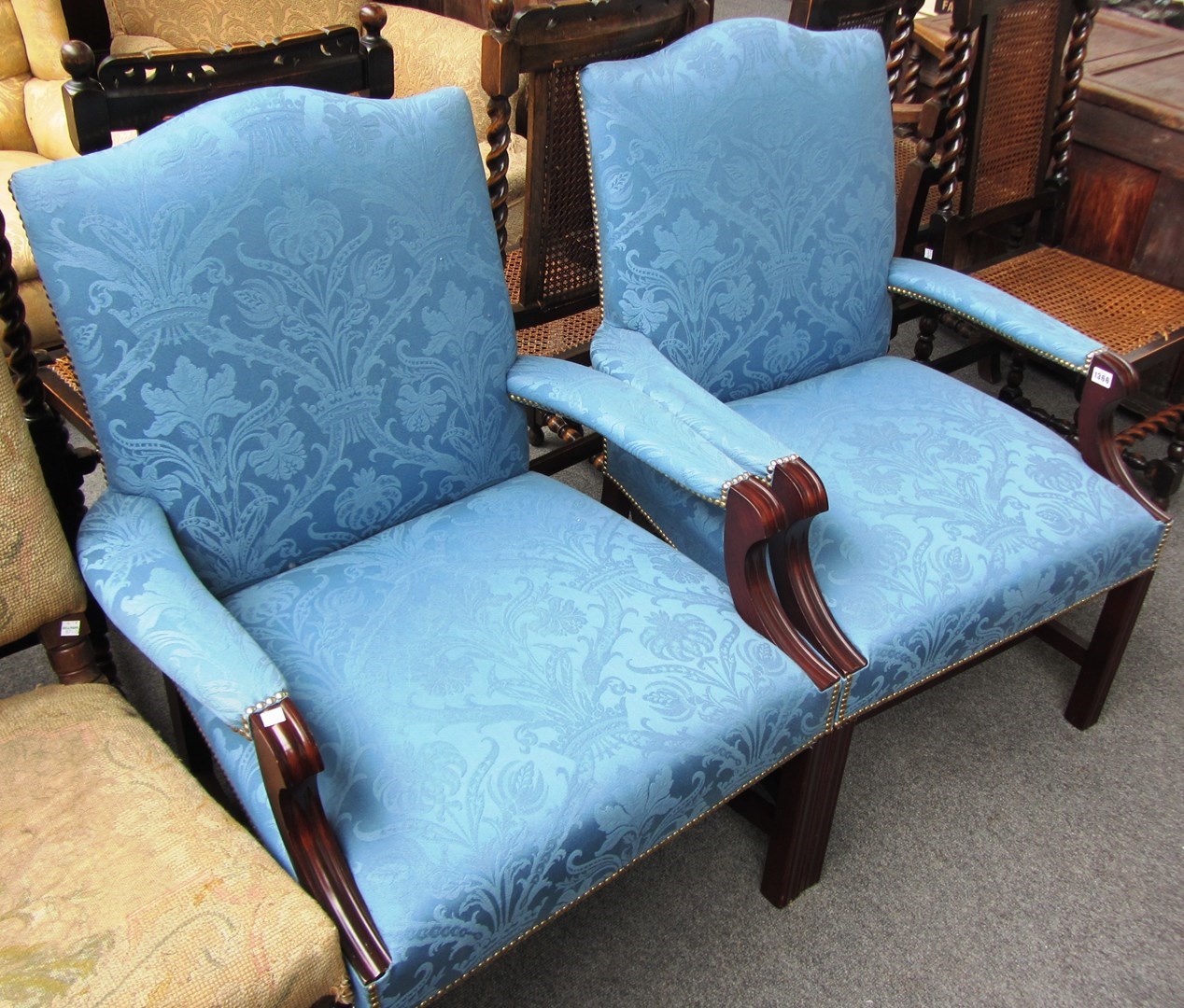 Appraisal: A pair of th century style blue upholstered Gainsborough style