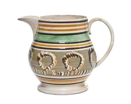 Appraisal: A Mochaware Pitcher of baluster form with an applied handle