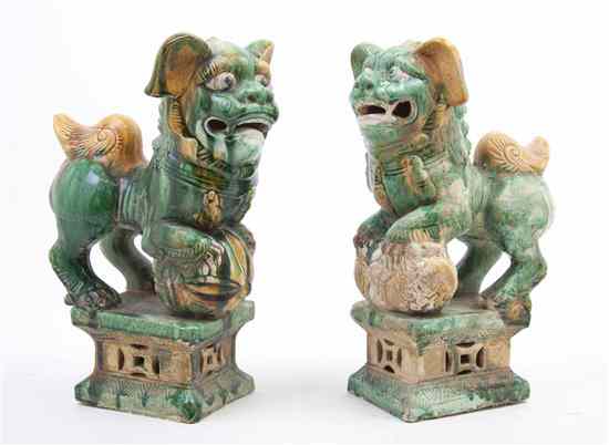 Appraisal: A Near Pair of Chinese Glazed Ceramic Fu Dogs each