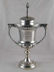 Appraisal: A large silver two handled lidded trophy cup the finial