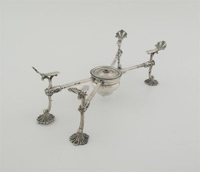 Appraisal: A George III adjustable dish cross on pierced shell feet