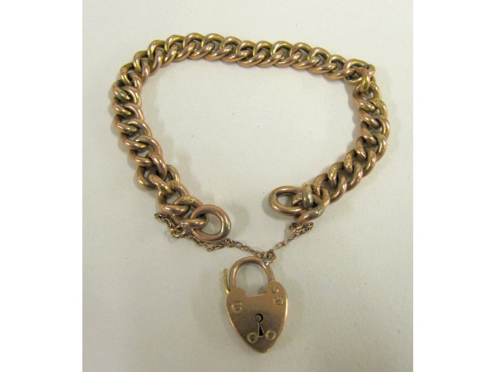 Appraisal: Nine carat rose gold curb link bracelet complete with padlock