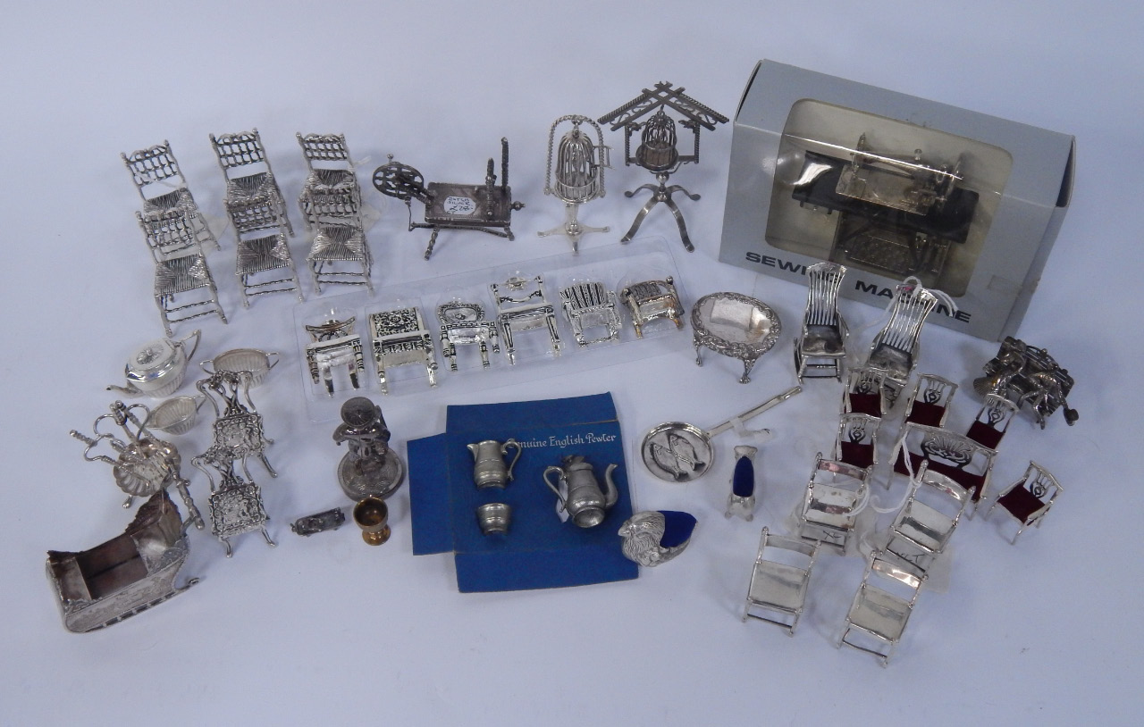 Appraisal: Miniature silver plated chairs sewing machine and a selection of