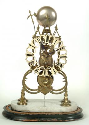 Appraisal: A MID VICTORIAN BRASS SKELETON MANTEL CLOCK the single fusee