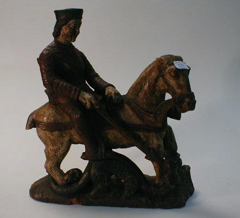 Appraisal: A polychrome figure of St George slaying the Dragon AF