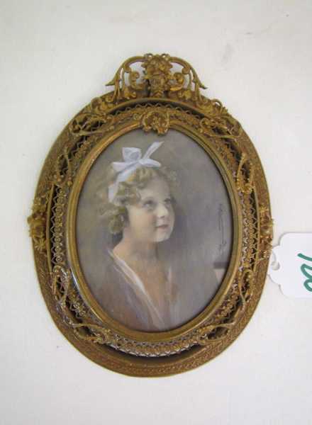 Appraisal: A MINIATURE OVAL PORTRAIT of a young girl wearing pale