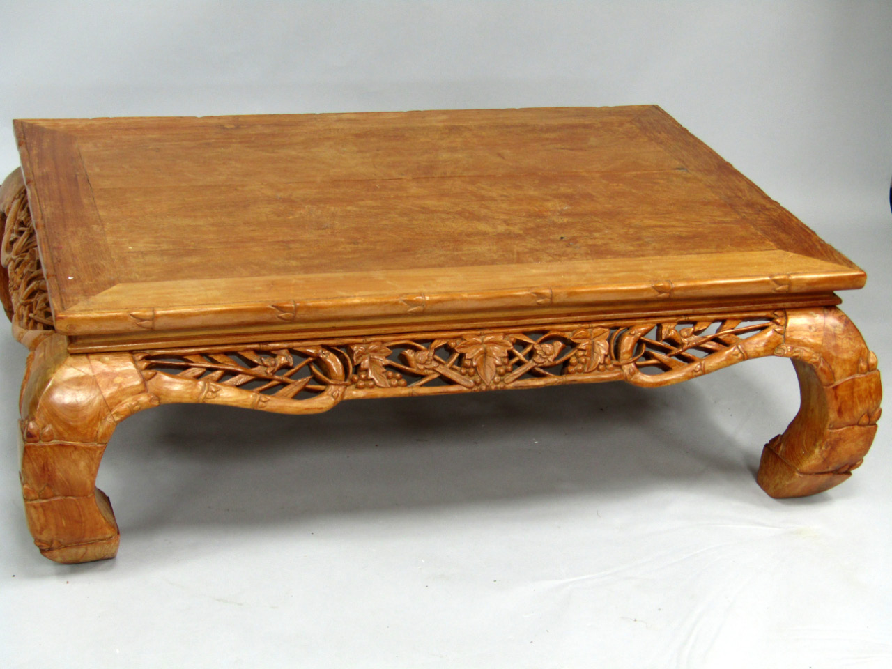 Appraisal: An Indonesian carved hardwood centre table with rectangular top with