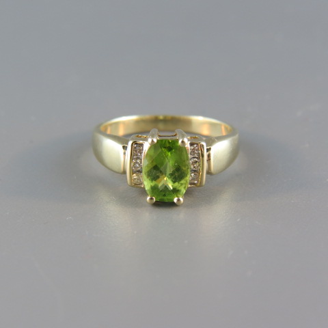 Appraisal: Peridot and Diamond Ring vivid oval carat gem with three