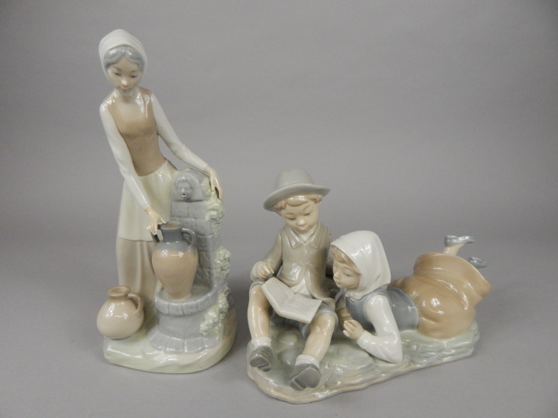 Appraisal: Two Nao porcelain figures one in the form of a