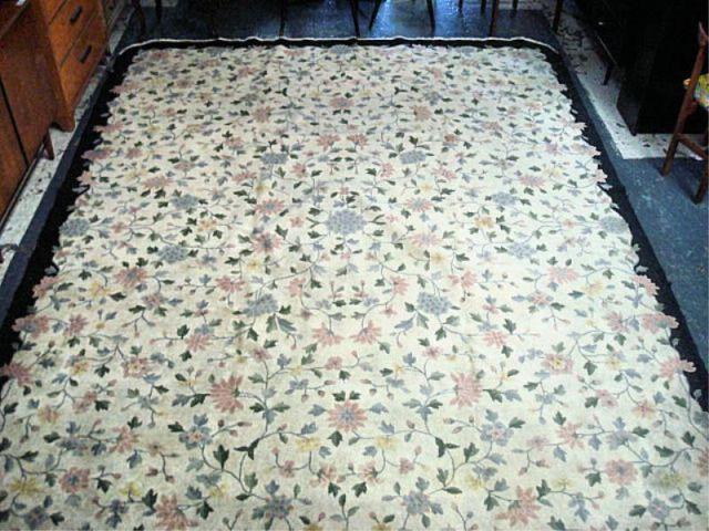 Appraisal: Chinese Carpet with Floral Pattern and Black Border Dimensions approx