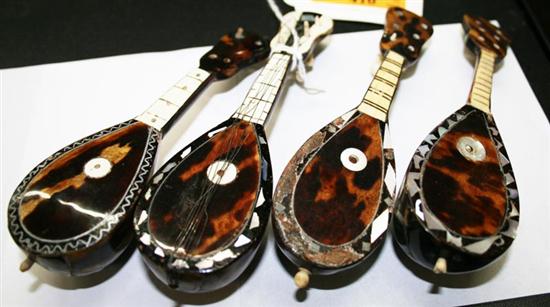 Appraisal: Miniature tortoise mandolins th century inlaid with ivory and mother-of-pearl