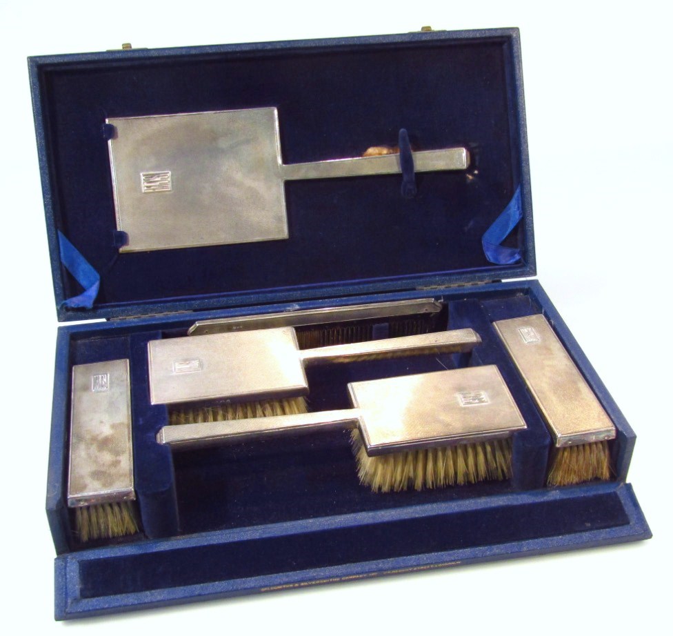 Appraisal: A George VI silver dressing table set by Goldsmith Silversmith's