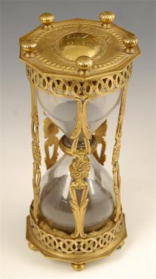 Appraisal: An Italian gilt brass hour glass each end with a