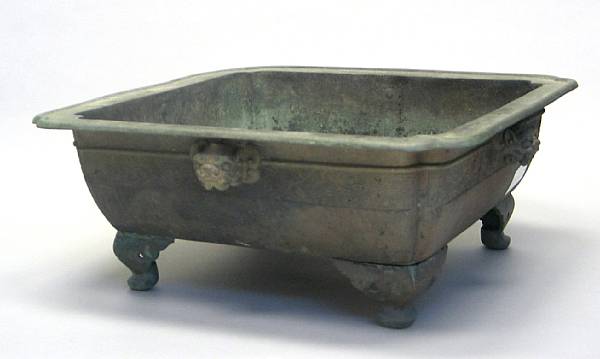 Appraisal: A Japanese square-sectioned bronze hibachi Raised on four corner feet