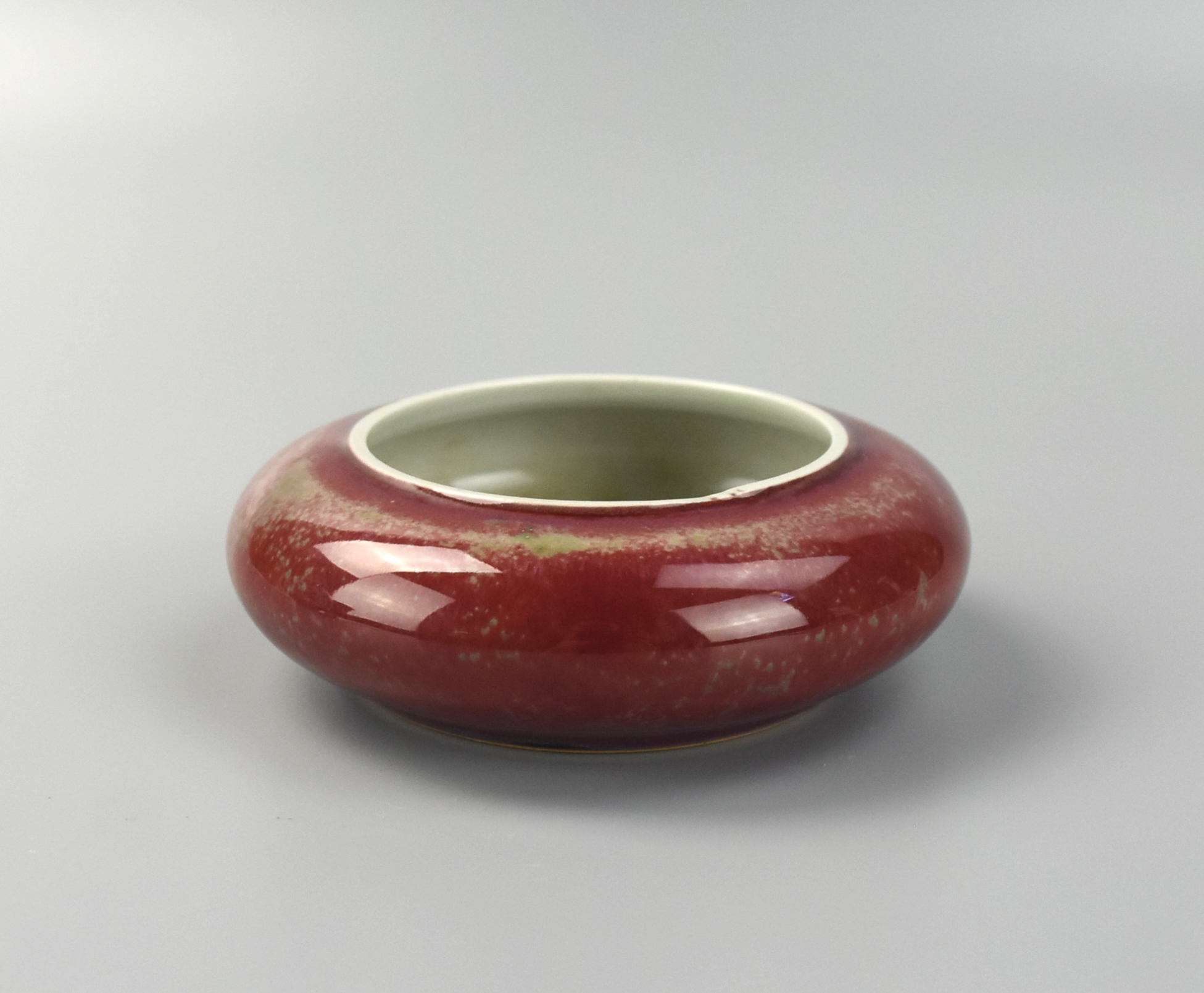 Appraisal: CHINESE PEACH-BLOOM GLAZE WASHER Chinese washer features a thick peach