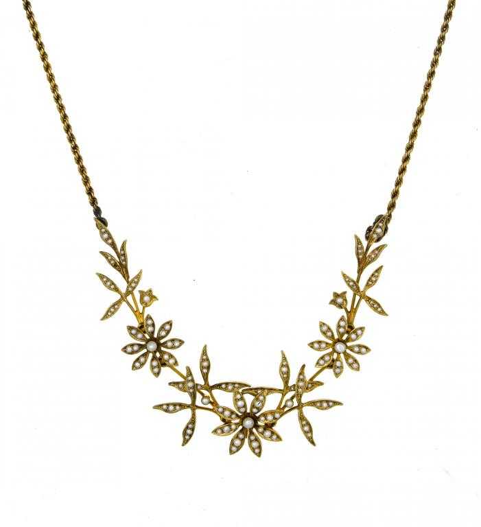 Appraisal: A GOLD AND SEED PEARL NECKLET composed of three flowers