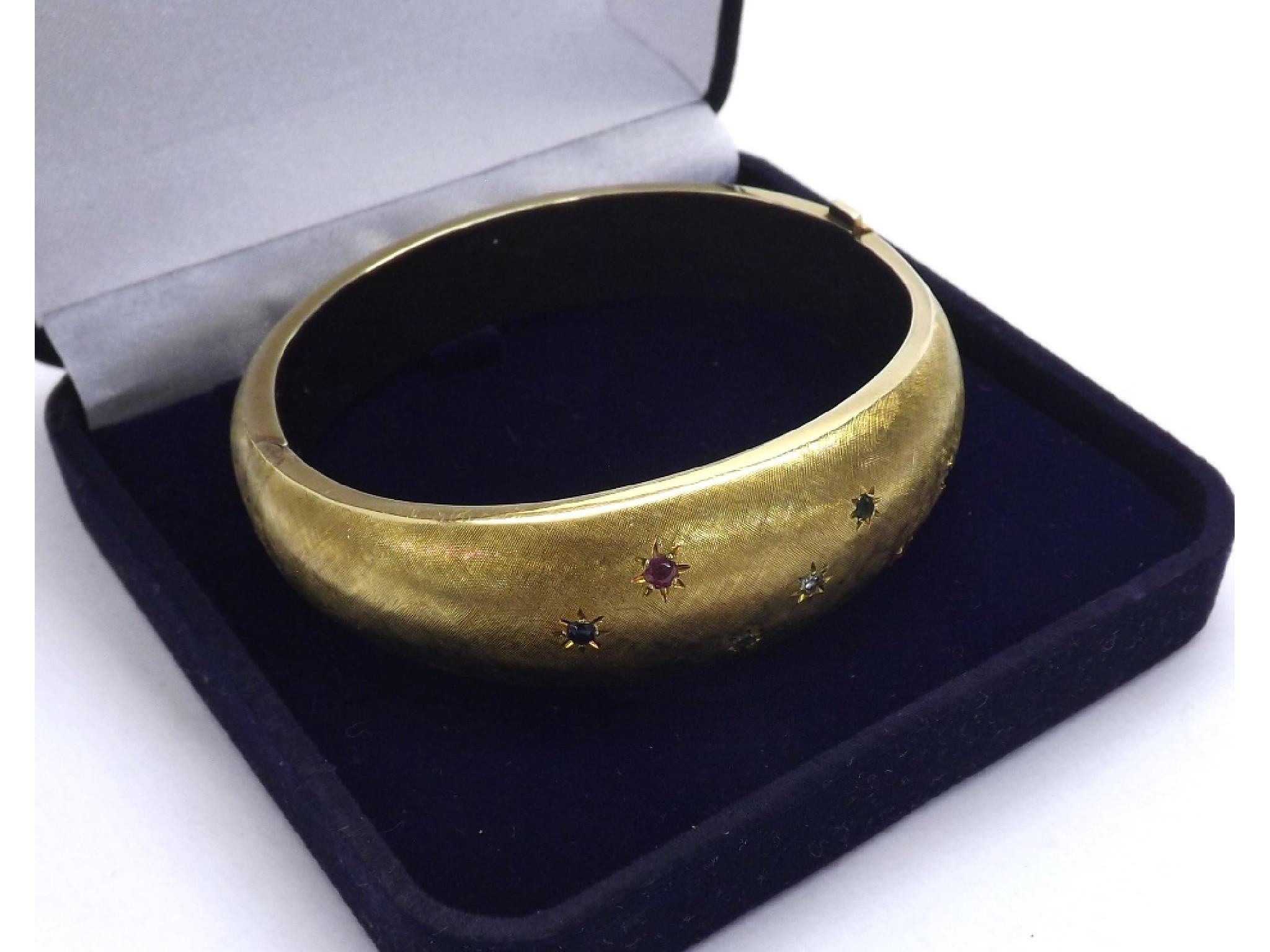 Appraisal: ct yellow gold textured hinged bangle set with a diamond