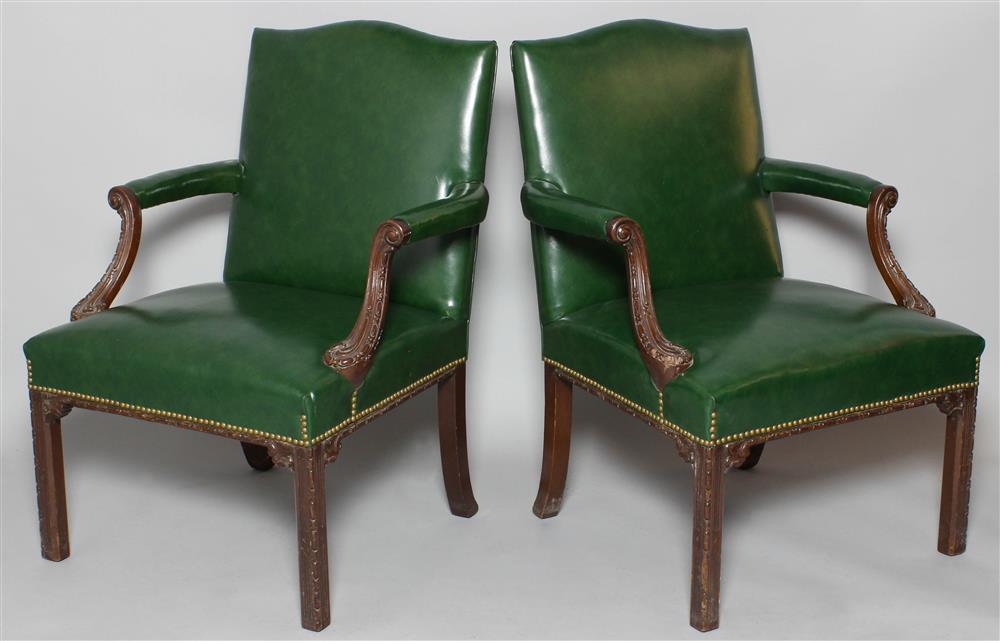 Appraisal: PAIR OF GEORGE III STYLE CARVED MAHOGANY LIBRARY CHAIRS the