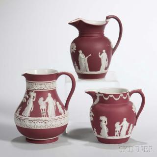 Appraisal: Three Wedgwood Crimson Jasper Dip Jugs England c each with