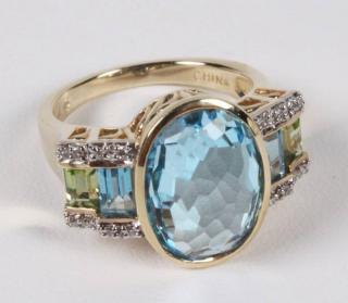 Appraisal: K DIAMOND BLUE TOPAZ AND PERIDOT LADIES RING K YELLOW