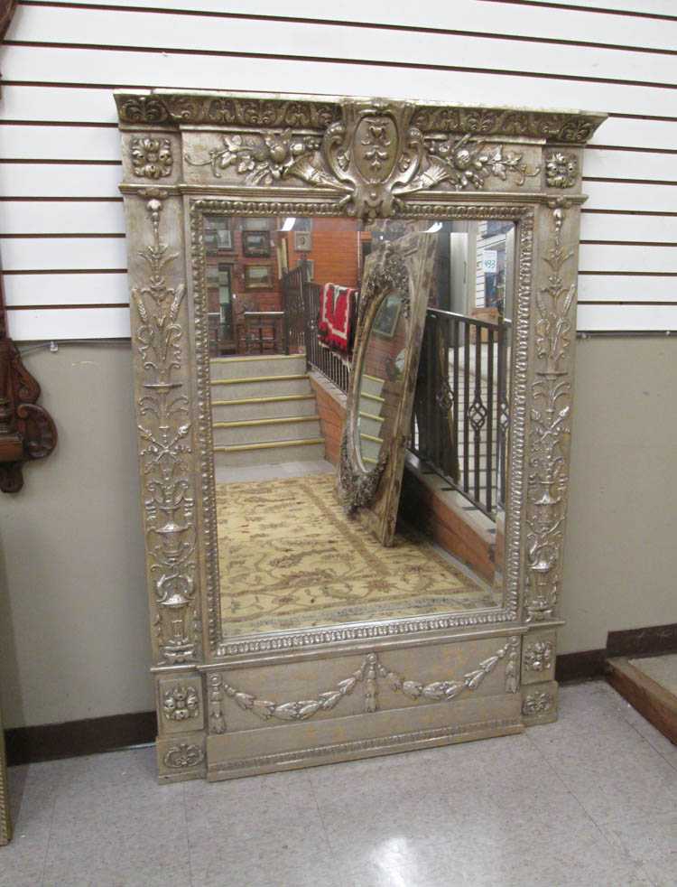 Appraisal: CARVED AND SILVER-GILT WALL MIRROR antique reproduction H x W