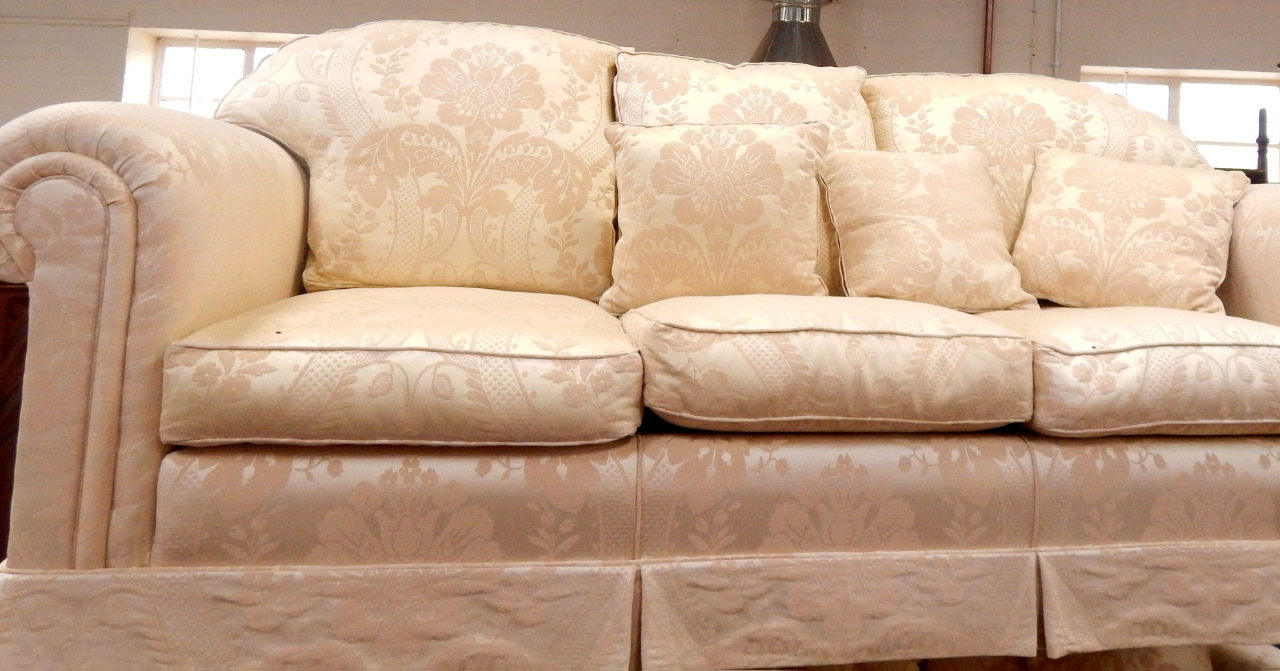 Appraisal: A Rousseau three seater sofa upholstered in patterned ivory damask