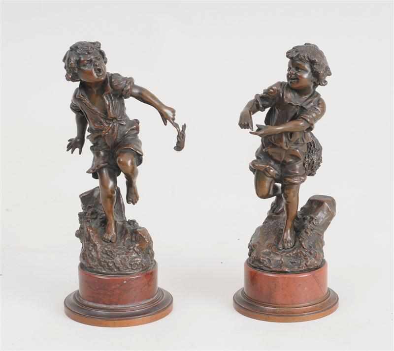 Appraisal: AFTER CARL KAUBA FISHING BOYS A PAIR Bronzes signed C